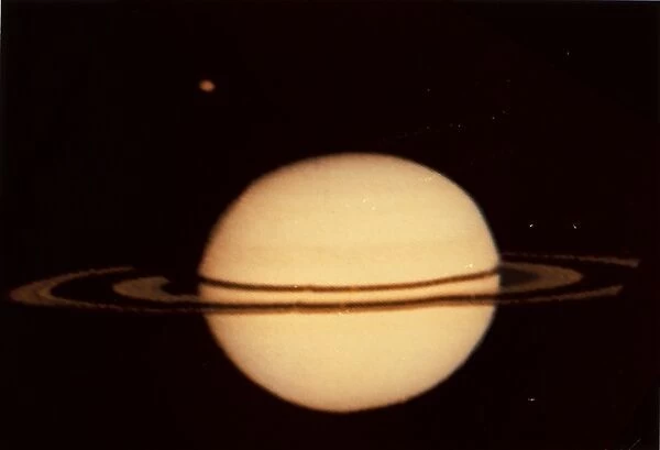 Pioneer 11 Image of Saturn and its Moon Titan