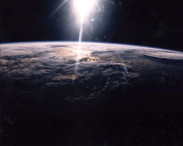 Sunlight over Earth as seen by STS-29 crew