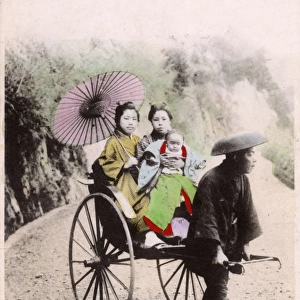 Japan - Two Japanese women and a baby take a rickshaw ride