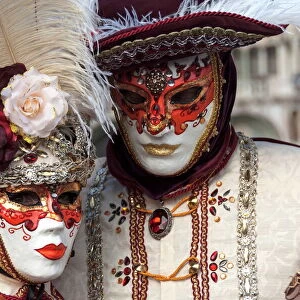 Lady and gentleman in red and white masks, Venice Carnival, Venice, Veneto, Italy, Europe