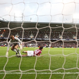 Robin van Persie shoots past West Ham goalkeeper Robert