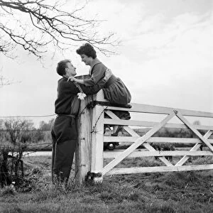 Romantic couple take a stroll in the country side. Richard Camp and Diane Ford. A651